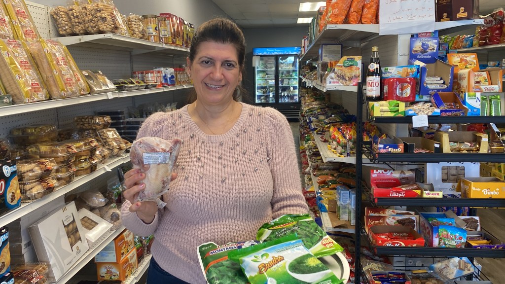 Karmen is the owner of Alpha-T Mediterranean Market located in the Lynnwood International Markets. Here she stands in her shop with ingredients for stuffed squab and green soup